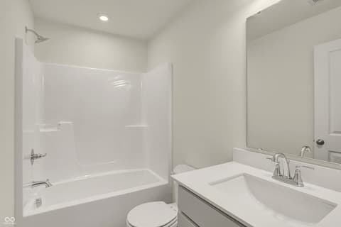 Primary bathroom at 19488 Atwater, Sheridan, IN — Bright, modern primary bathroom with clean white finishes.