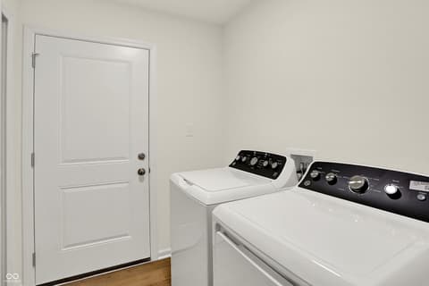 Laundry room at 19488 Atwater, Sheridan, IN — Modern laundry room with new washer and dryer.