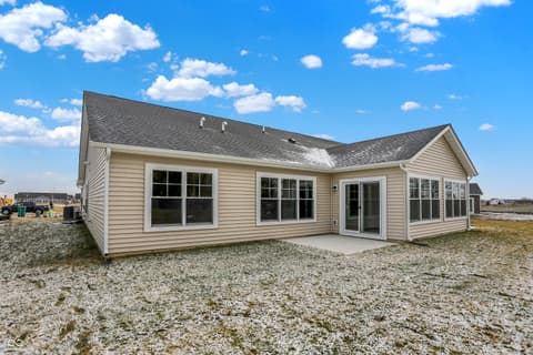 Front exterior at 19488 Atwater, Sheridan, IN — Bright new home with expansive windows and patio access.