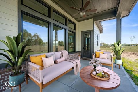 Outdoor living area at 19752 Chatsworth Boulevard, Westfield, IN — Modern covered patio with expansive rural views.