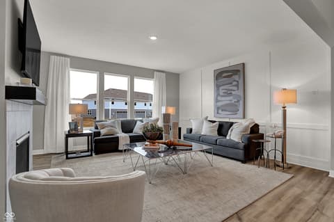 Living room at 19805 Hazelnut Boulevard, Noblesville, IN — Bright, open living room with multiple seating areas.