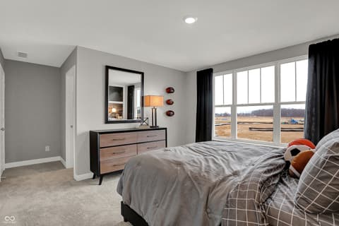 Primary bedroom at 19805 Hazelnut Boulevard, Noblesville, IN — Spacious primary bedroom with expansive rural views.