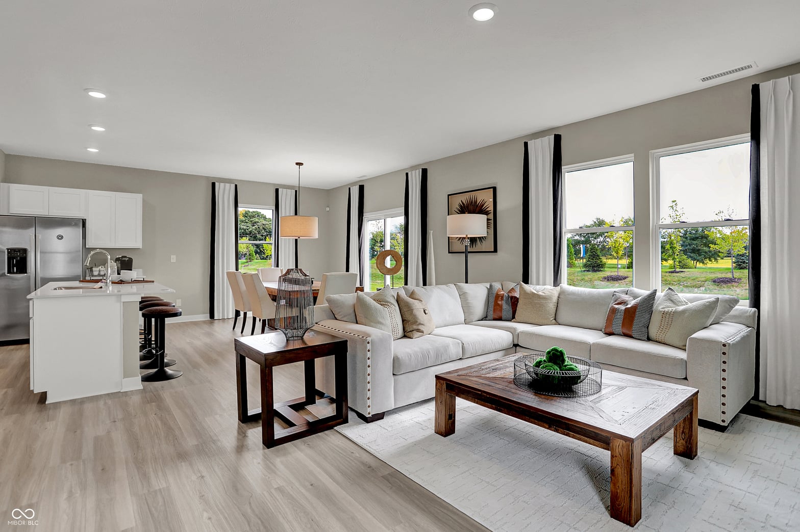 Bright open-concept living with expansive windows and modern finishes.