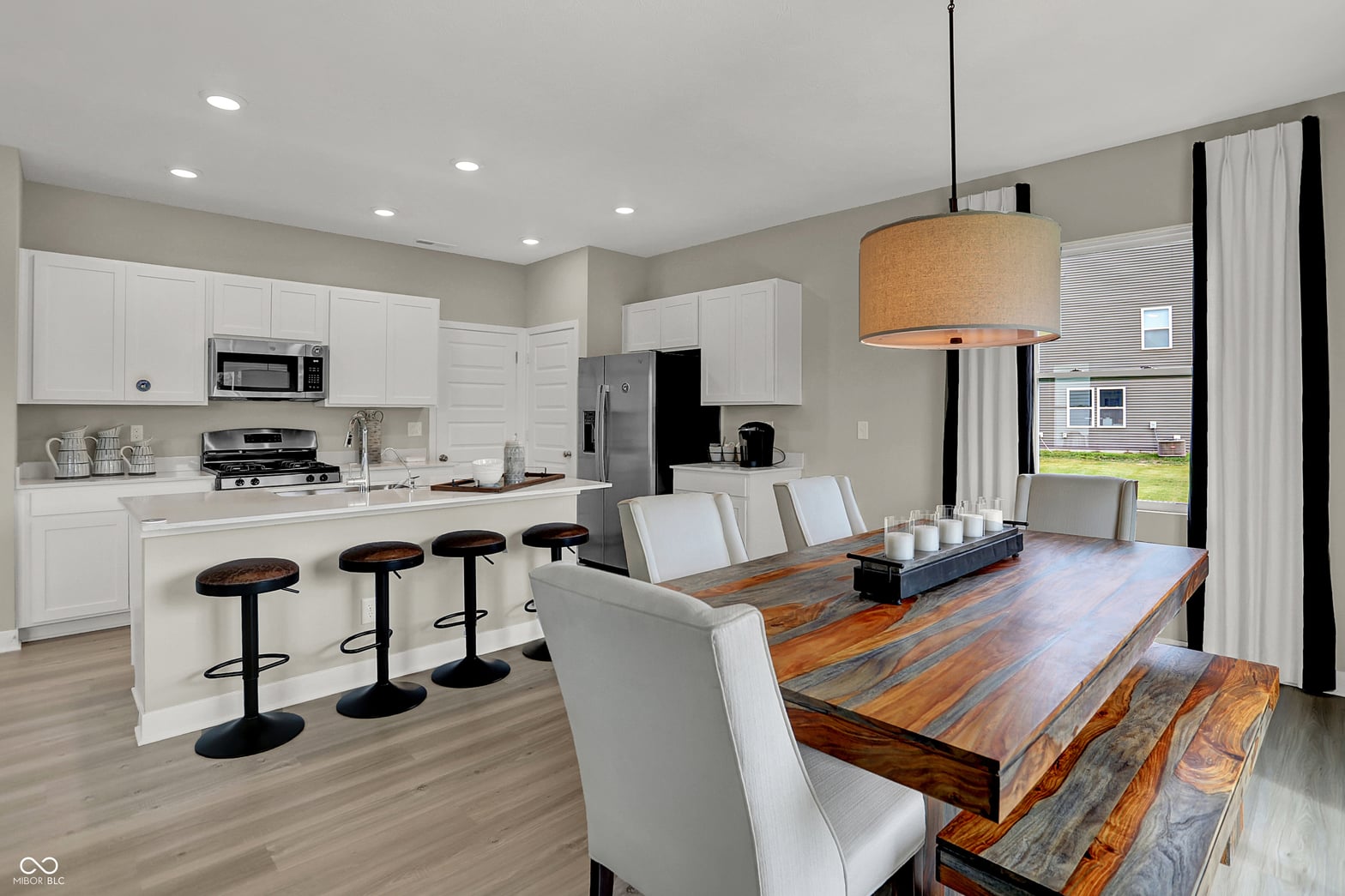 Bright open-concept kitchen with island and modern finishes.