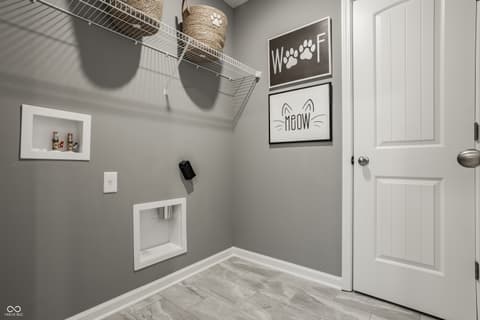 Laundry room at 544 Wise Way, Arcadia, IN — Dedicated pet feeding area with organized storage solutions.