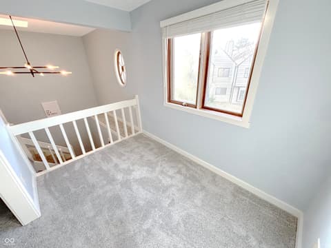 Bedroom at 9728 Revere Way, Indianapolis, IN — Bright bedroom with large windows and modern updates.