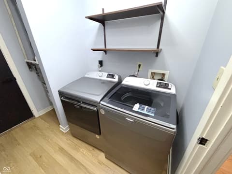 Laundry room at 9728 Revere Way, Indianapolis, IN — Modern laundry room with stainless steel appliances.