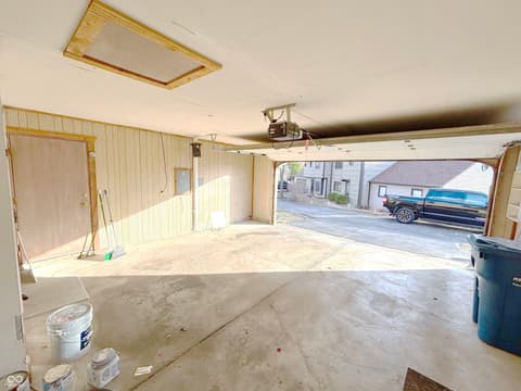 Garage at 9728 Revere Way, Indianapolis, IN — Spacious two-car garage with natural light and storage.