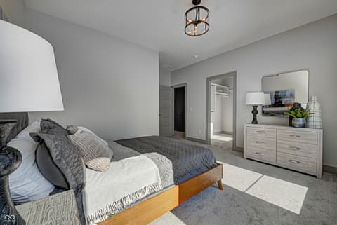 Primary bedroom at 162 Midland Trace Loop, Westfield, IN — Spacious primary bedroom with ensuite bathroom access.
