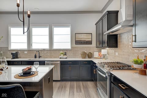 Kitchen at 162 Midland Trace Loop, Westfield, IN — Modern updated kitchen with premium finishes and island.