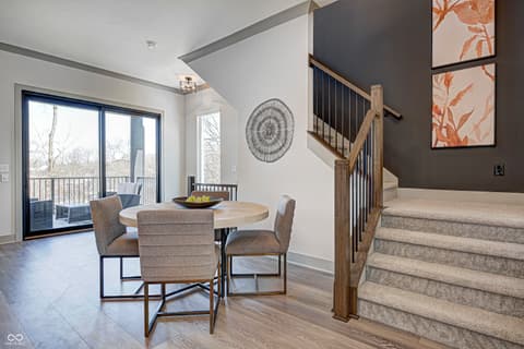 Foyer at 162 Midland Trace Loop, Westfield, IN — Bright two-story foyer with modern dining and deck access.
