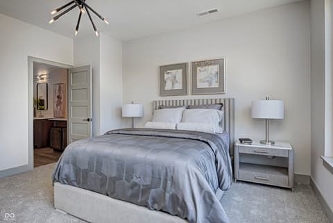 Primary bedroom at 162 Midland Trace Loop, Westfield, IN — Spacious primary suite with ensuite and designer finishes.