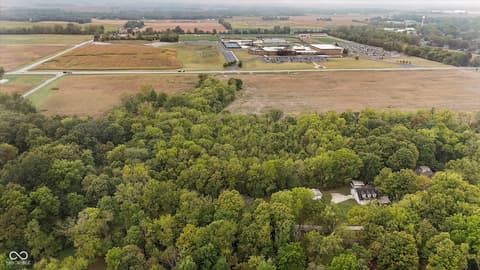 Aerial view at 9135 E 256th Street, Arcadia, IN — Secluded wooded estate with expansive countryside views.