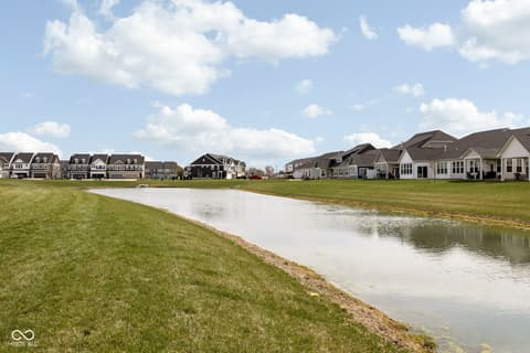 Aerial view at 887 Tuxedo Drive, Westfield, IN — Waterfront community with pond views and mature landscaping.
