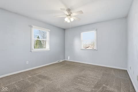 Bedroom at 415 Oxford Drive, Noblesville, IN — Bright bedroom with new carpet and fresh paint throughout.