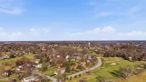 Aerial view at 415 Oxford Drive, Noblesville, IN — Scenic aerial view of established, tree-lined neighborhood.