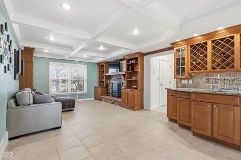 Family room at 415 Oxford Drive, Noblesville, IN — Spacious family room with built-in wet bar and fireplace.
