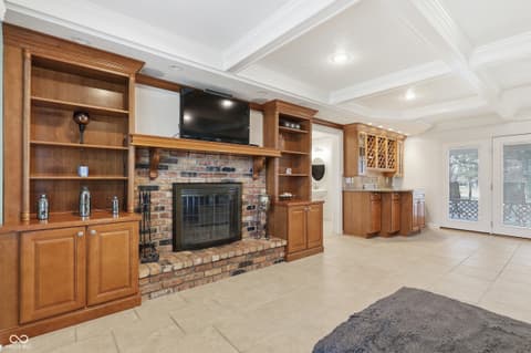 Family room at 415 Oxford Drive, Noblesville, IN — Elegant family room with custom built-ins and fireplace.