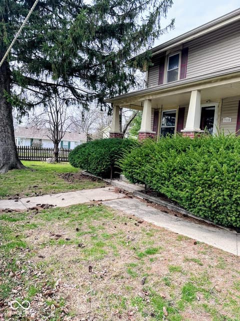 Front exterior at 310 2nd Street NE, Carmel, IN — Classic home with mature landscaping and front porch.
