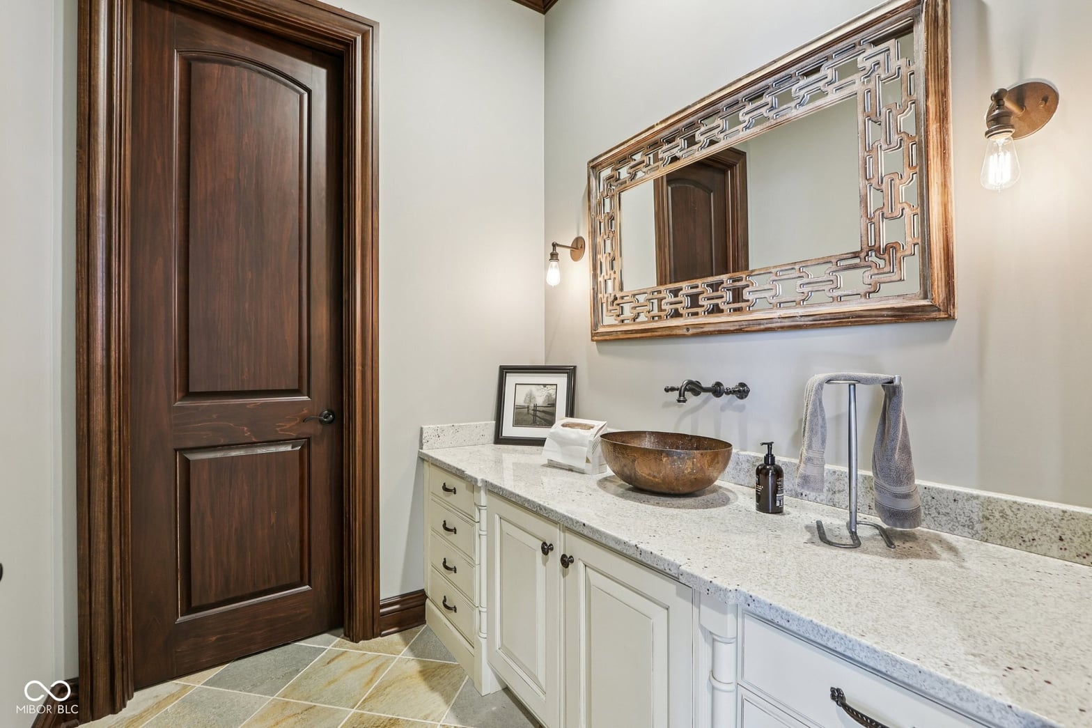 Elegant primary bath with quartz counters and dual vanity.