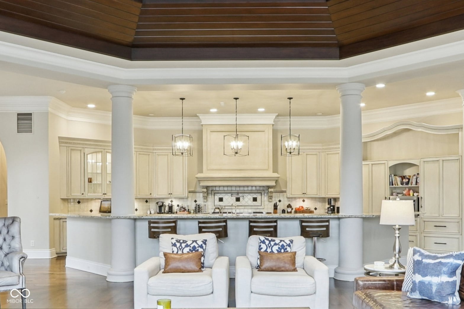 Luxurious open-concept kitchen with island and elegant finishes.