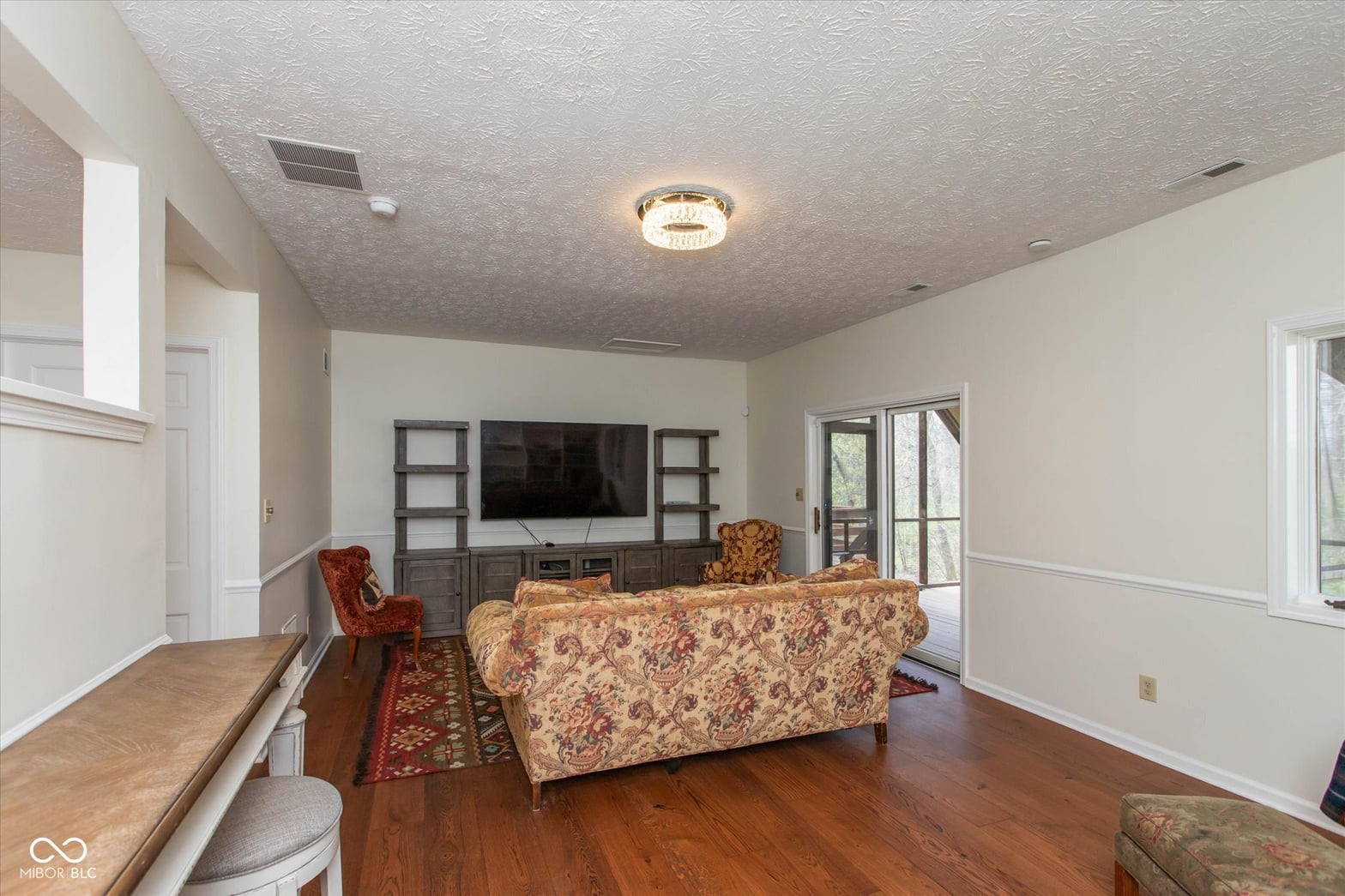 Spacious family room with built-in entertainment center.