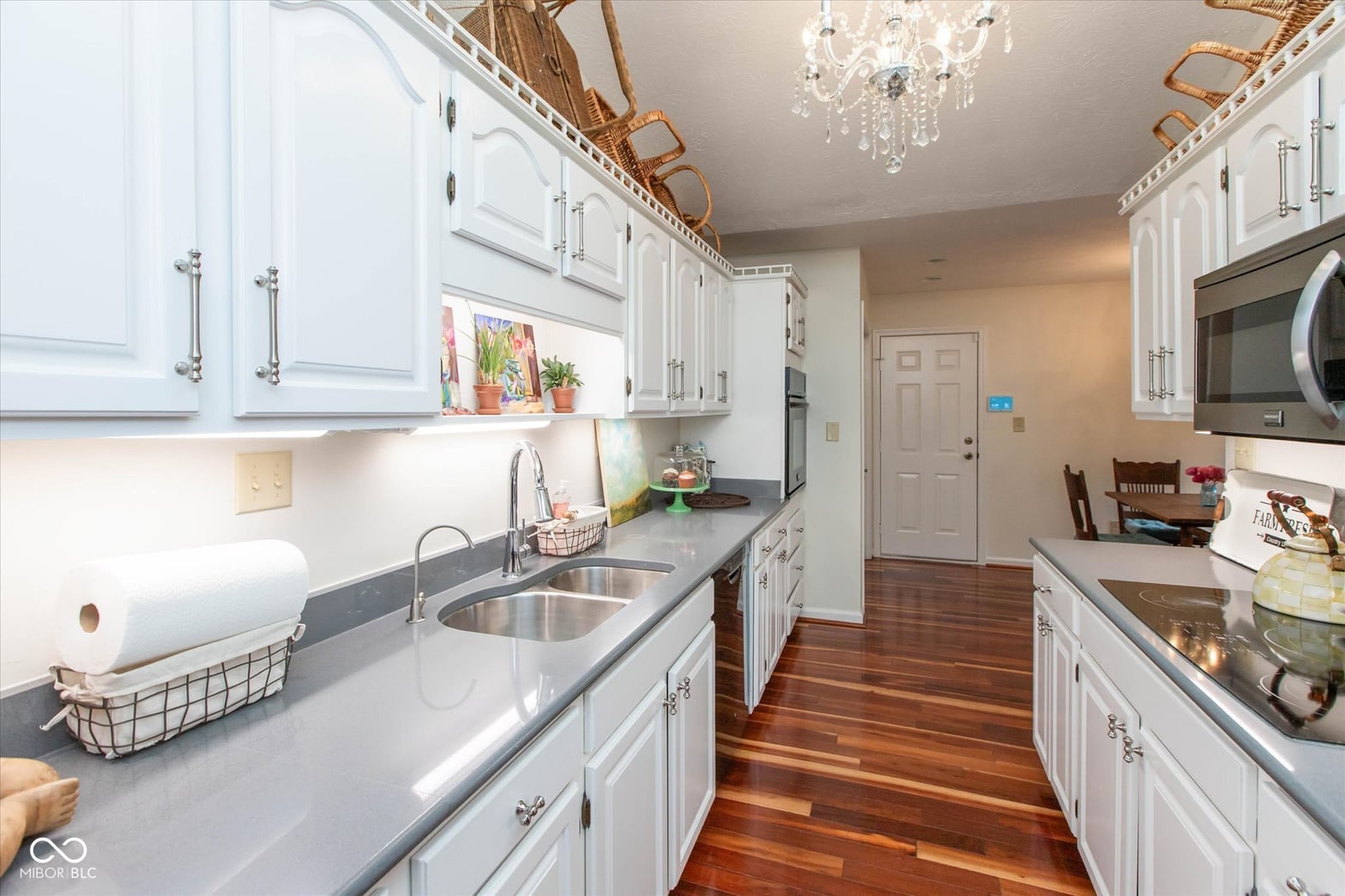 Bright, spacious galley kitchen with updated finishes throughout.
