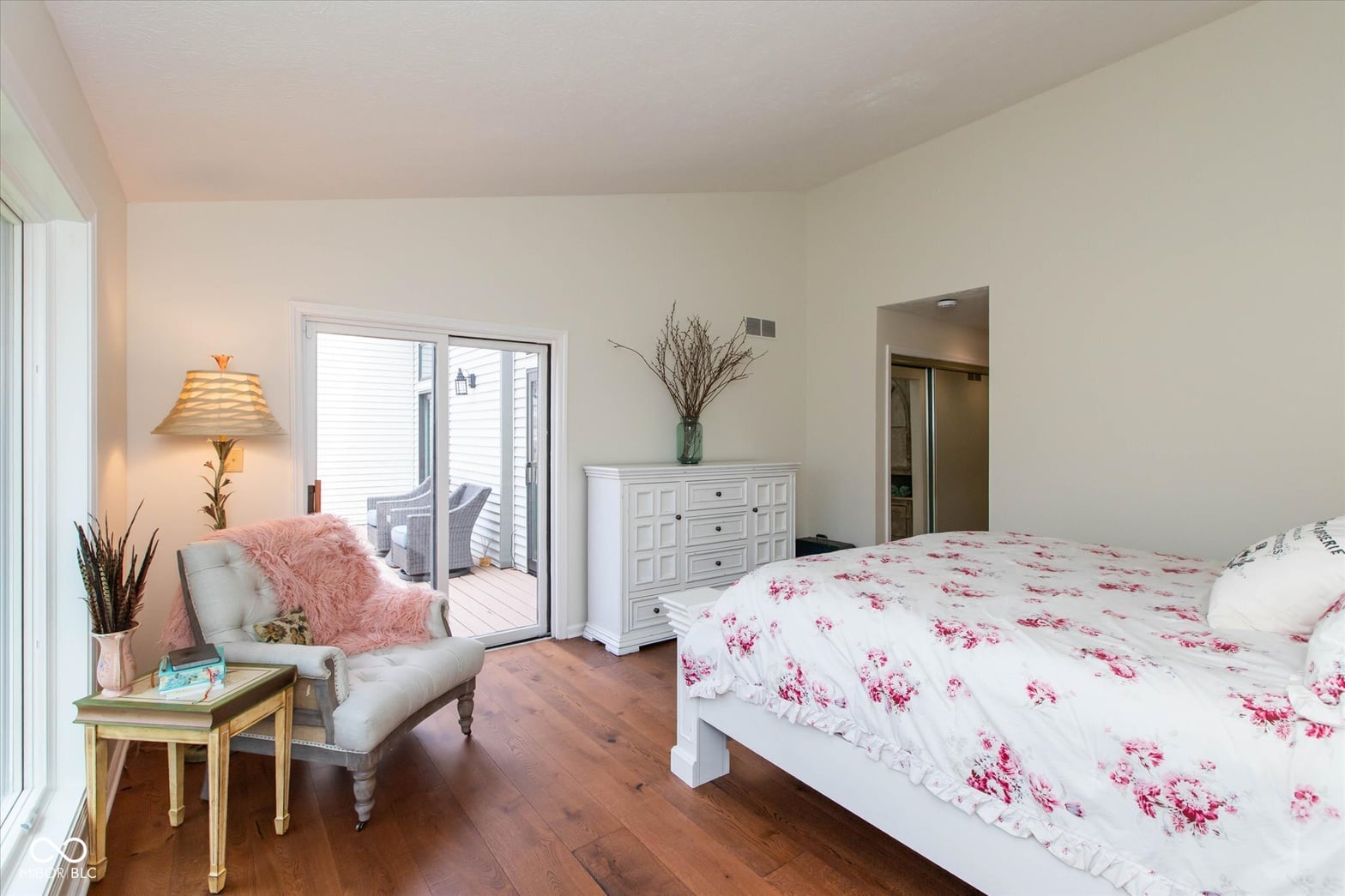 Bright primary bedroom with balcony access and ensuite.