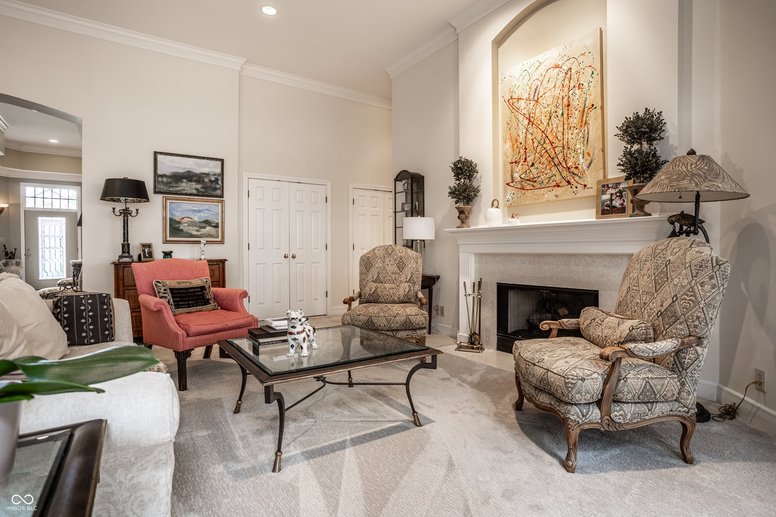 Elegant living room with fireplace and refined furnishings.