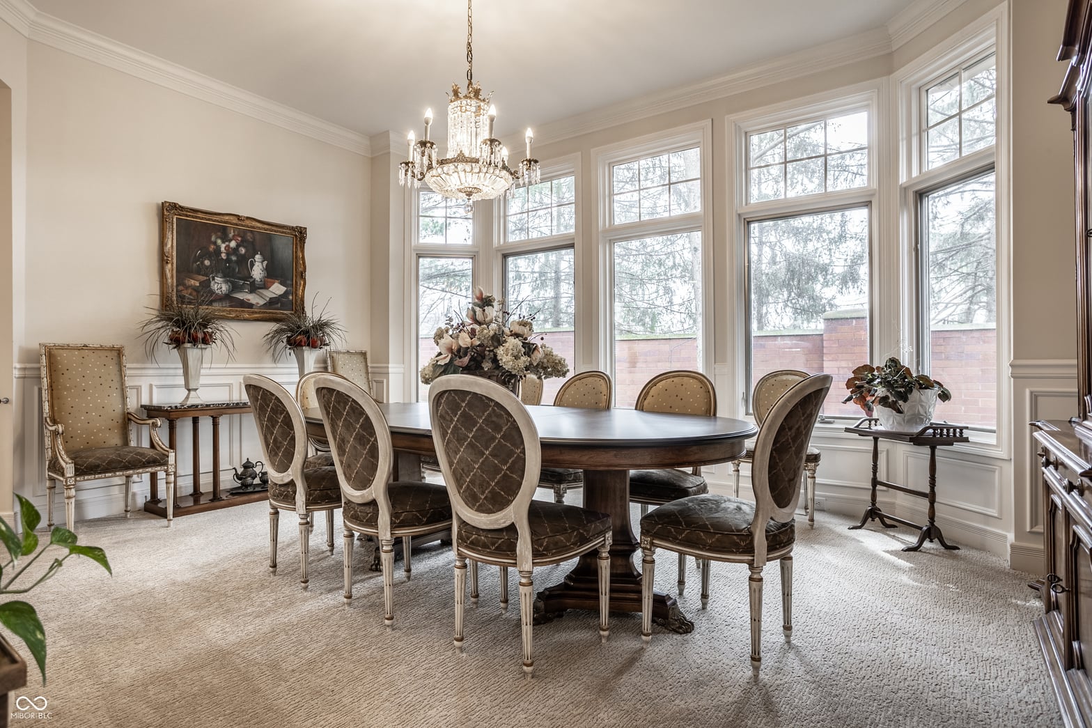 Elegant formal dining room with abundant natural light.