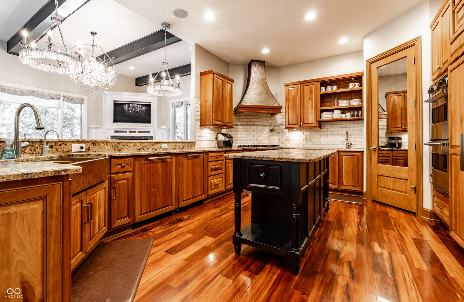 Luxurious kitchen with premium finishes and island.