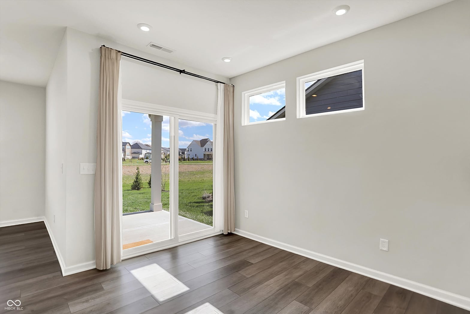Bright modern family room with french doors and patio access.
