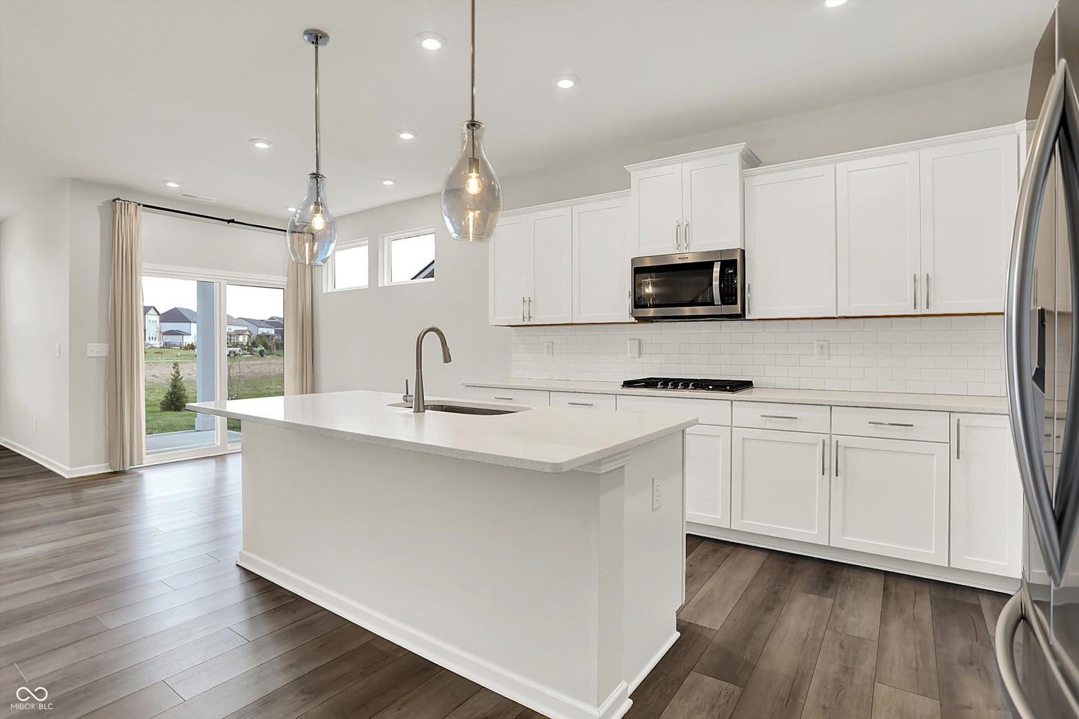 Bright, modern kitchen with premium finishes and large island.