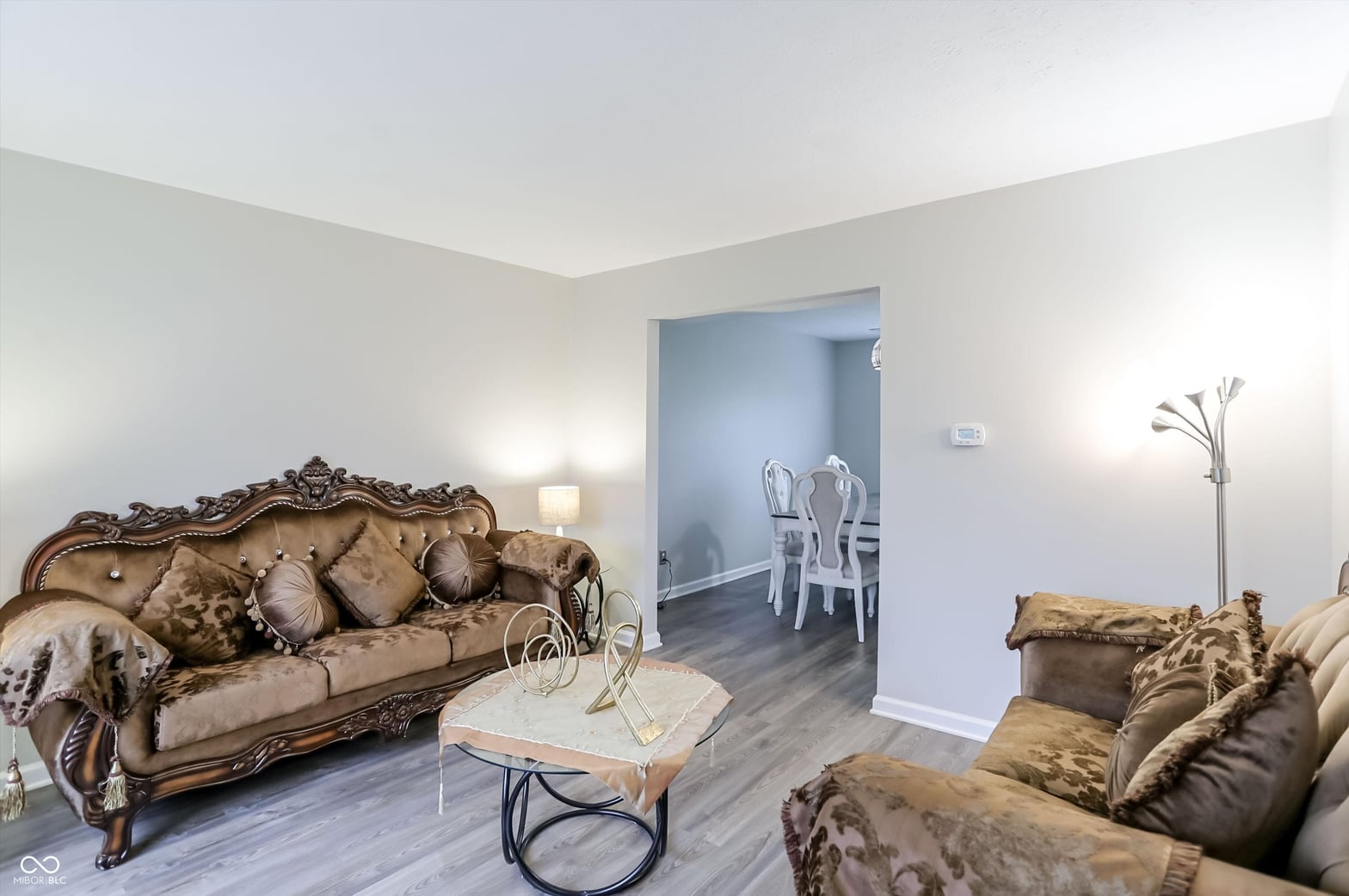 Elegant traditional living room with ornate furnishings.