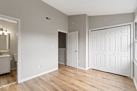 Primary bedroom at 6047 Southbay Drive, Indianapolis, IN — Spacious primary bedroom with walk-in closet and ensuite.