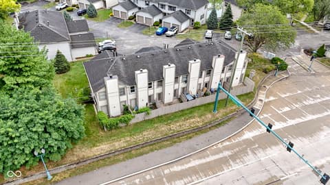 Aerial view at 6047 Southbay Drive, Indianapolis, IN — Modern multi-unit townhome complex with organized parking.