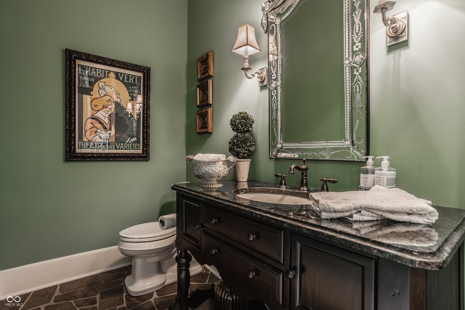 Elegant primary bath with marble counters and designer finishes.