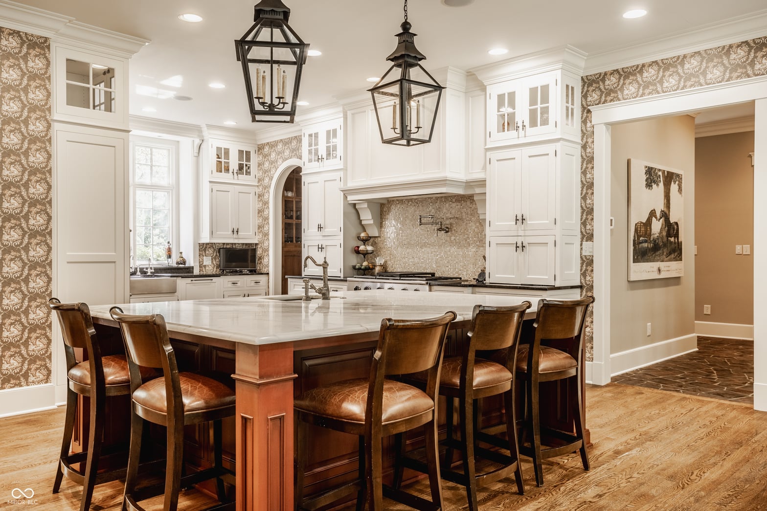 Elegant kitchen with marble island and designer finishes.