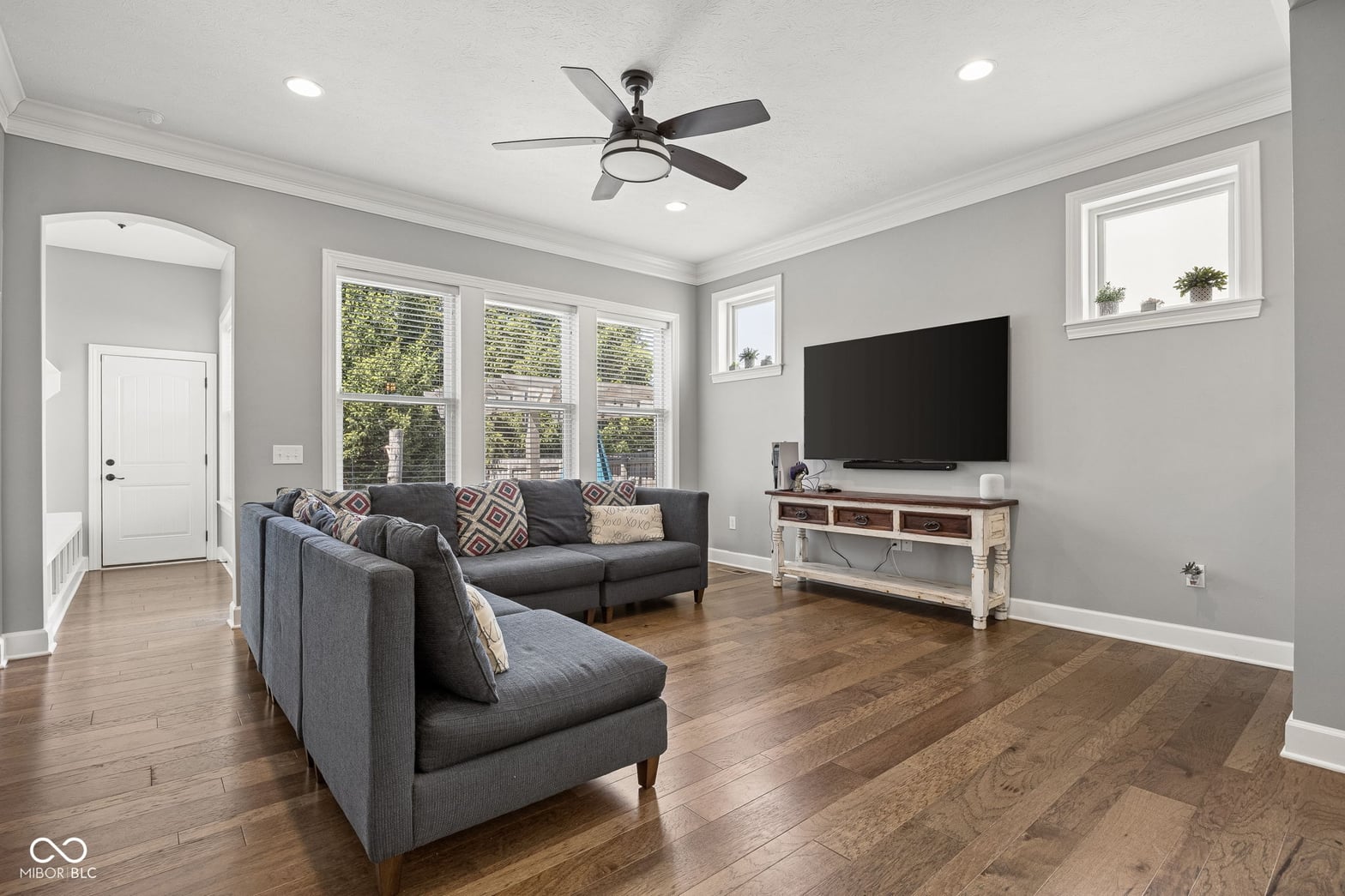 Bright, updated living room with hardwood floors and natural light.