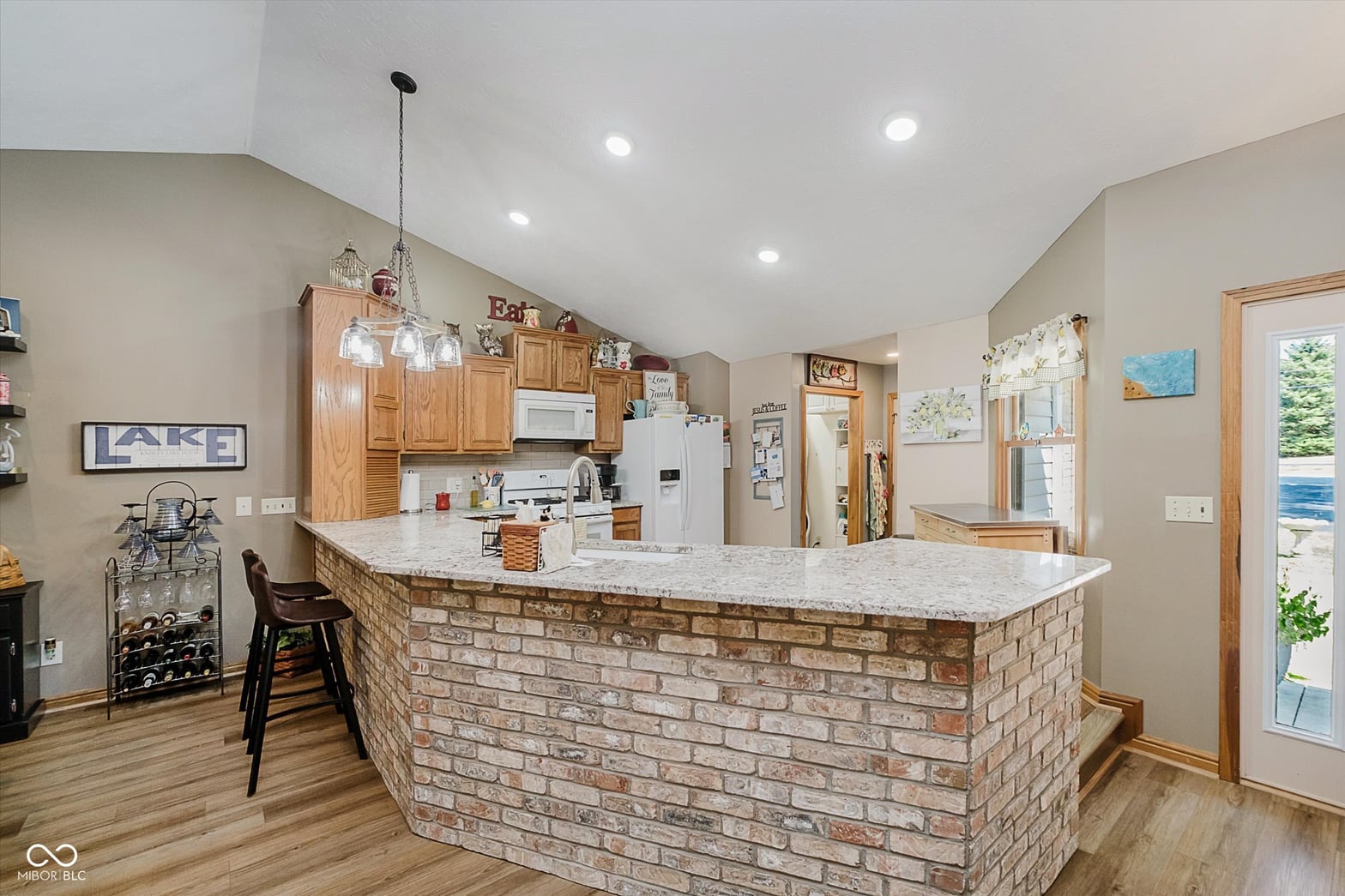 Kitchen at 2628 Inlet Drive, Cicero, IN — Spacious kitchen with brick island and granite counters.