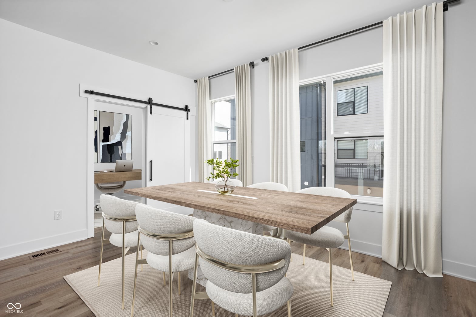 Bright modern dining space with abundant natural light.