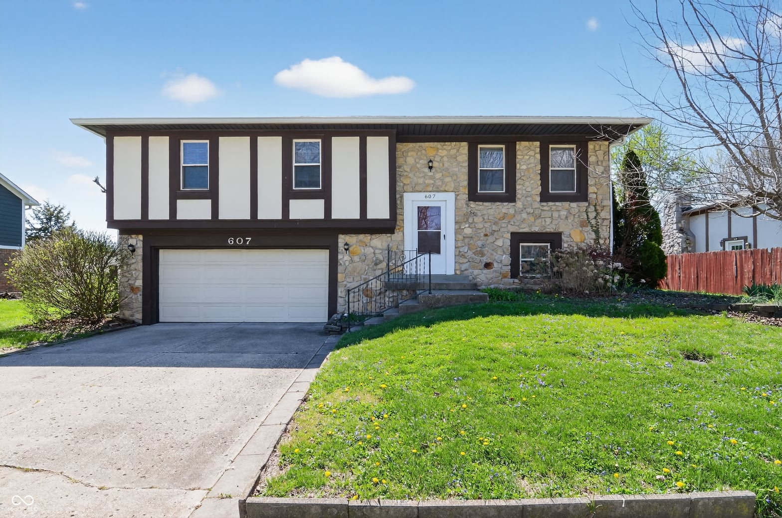 Front exterior at 607 Rahkewood Drive, Indianapolis, IN
