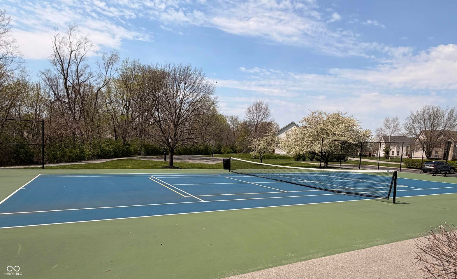 Professional tennis court with excellent condition and markings.
