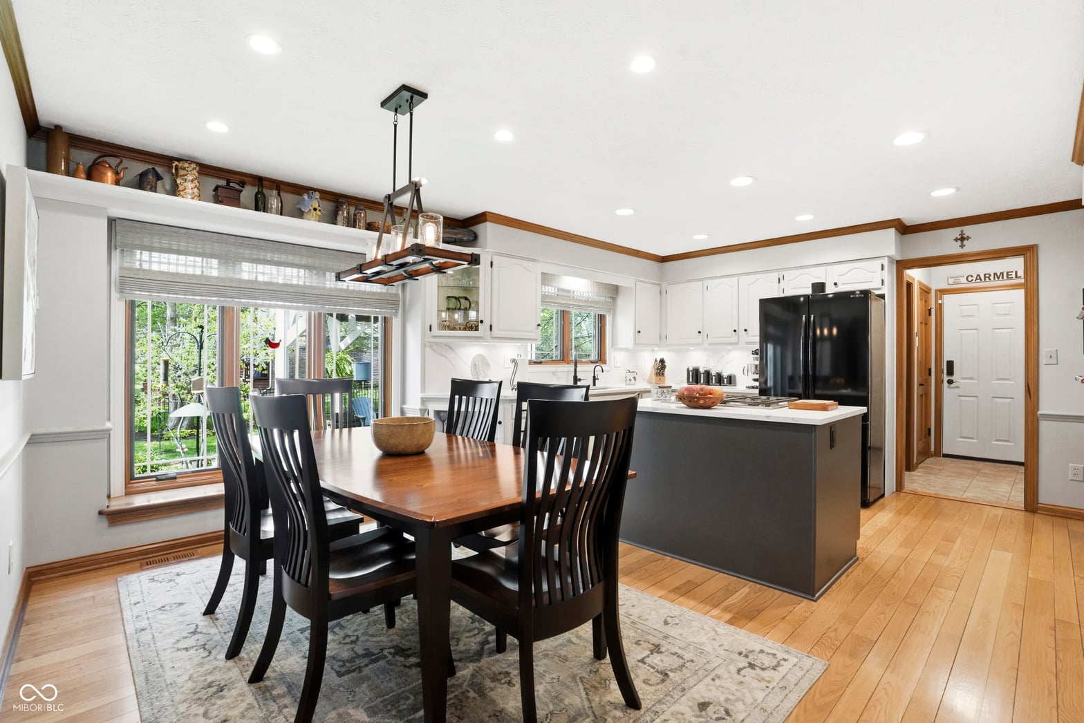 Open-concept kitchen with hardwood floors and modern updates.