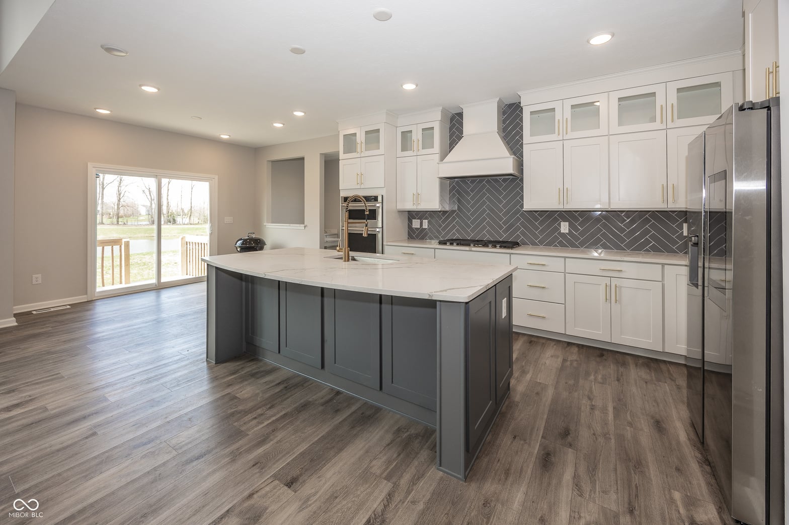 Bright modern kitchen with large island and quality finishes.