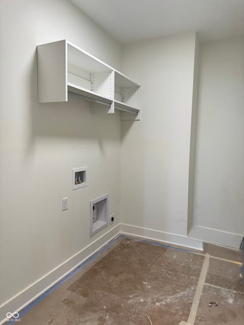 Laundry room at 16533 Iron Tree Court, Westfield, IN — New construction laundry room with custom wall storage.
