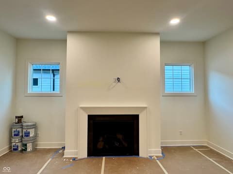 Family room at 16533 Iron Tree Court, Westfield, IN — Bright new construction family room with fireplace.