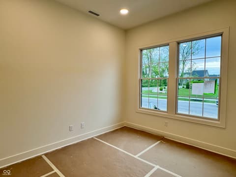 Home office at 16533 Iron Tree Court, Westfield, IN — Bright office with stunning water views and natural light.