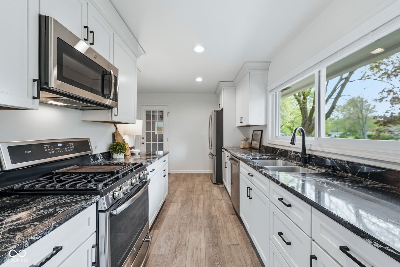 Bright modern kitchen with premium finishes and abundant windows.