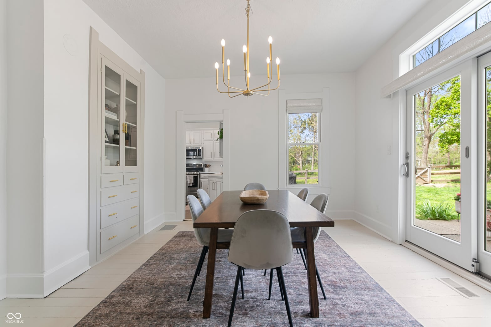 Bright modern dining with direct backyard access.